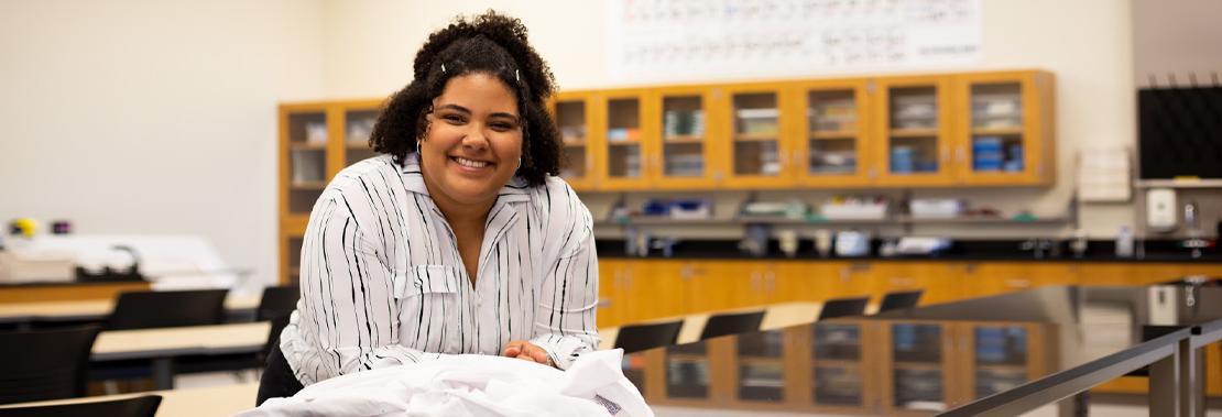 Ana Silva Pereira poses smiling in a Northwest Campus Lab