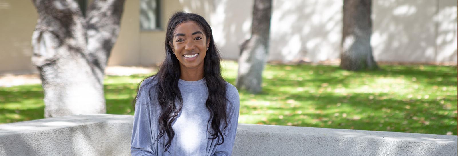 Genesis Benedith poses for the camera at Pima's Downtown Campus.